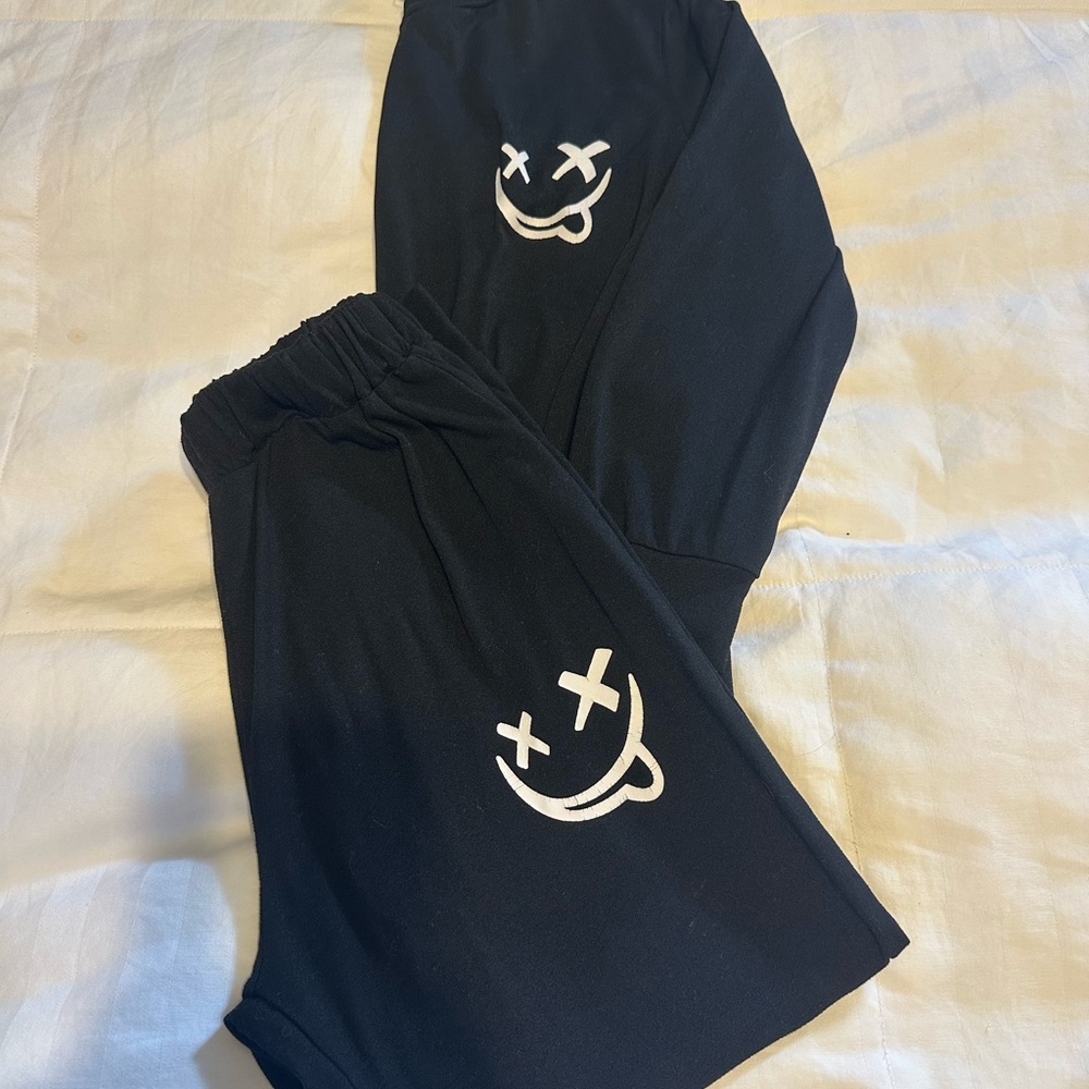 SHEIN Kids Black Joggers with Fun Face Print